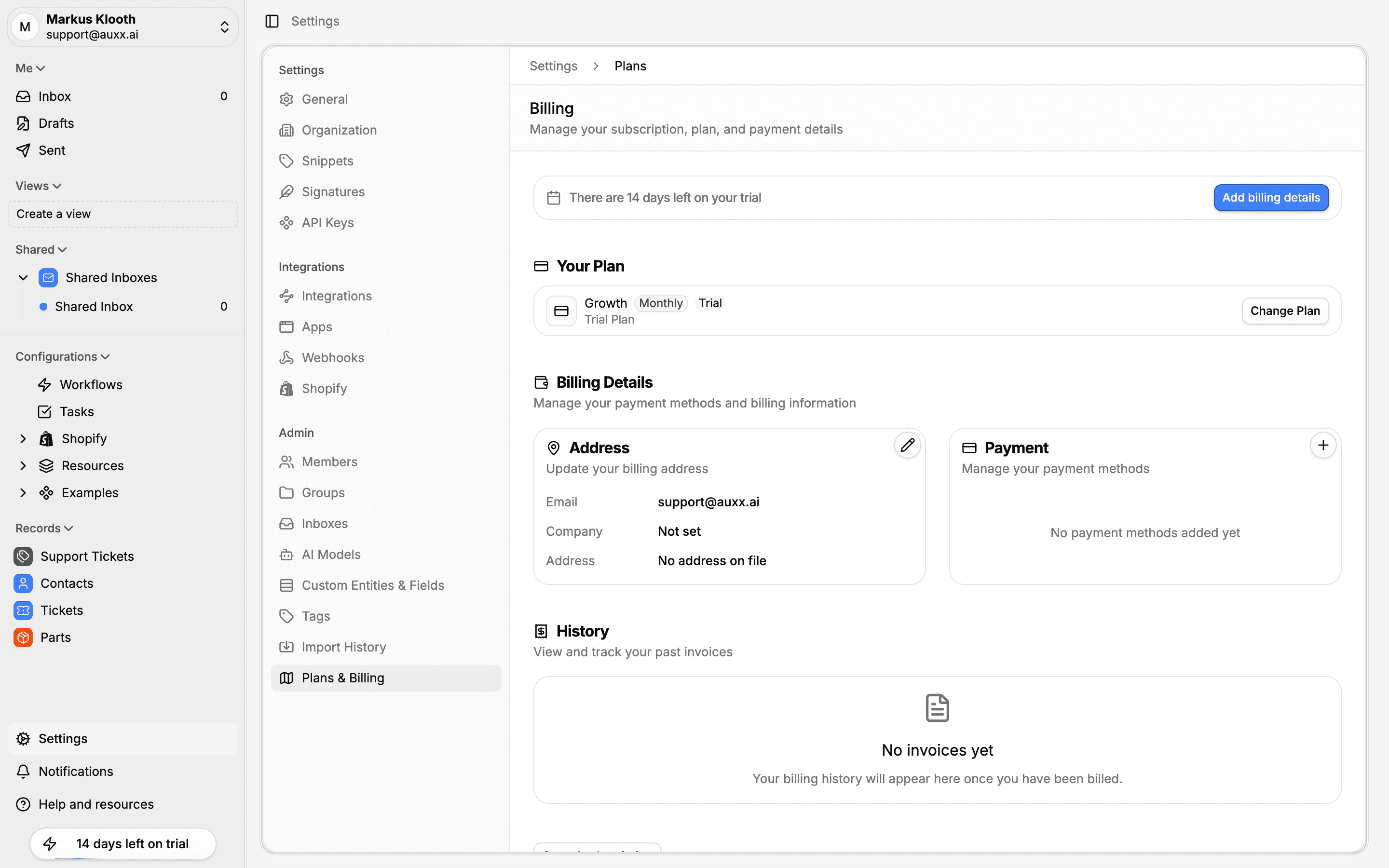 Plans & Billing settings page showing current plan, billing details, and invoice history